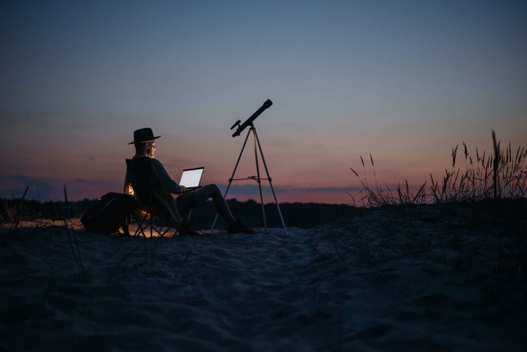 a person using a laptop outside at night